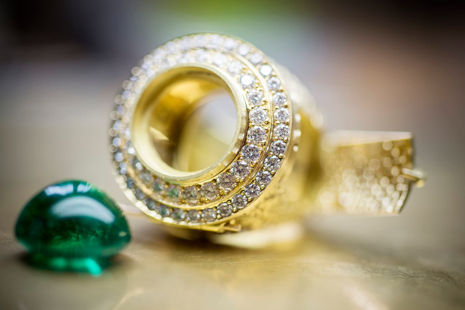 Two rows of pave diamonds are set to encircle the centre stone