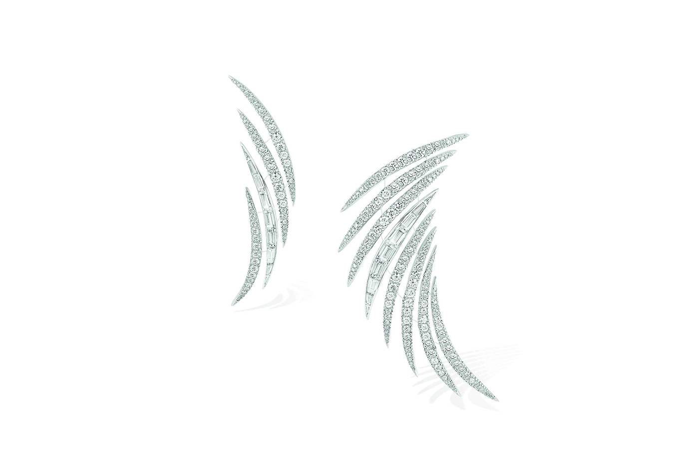 Another pair of earrings drawing dynamic curves along the ear
