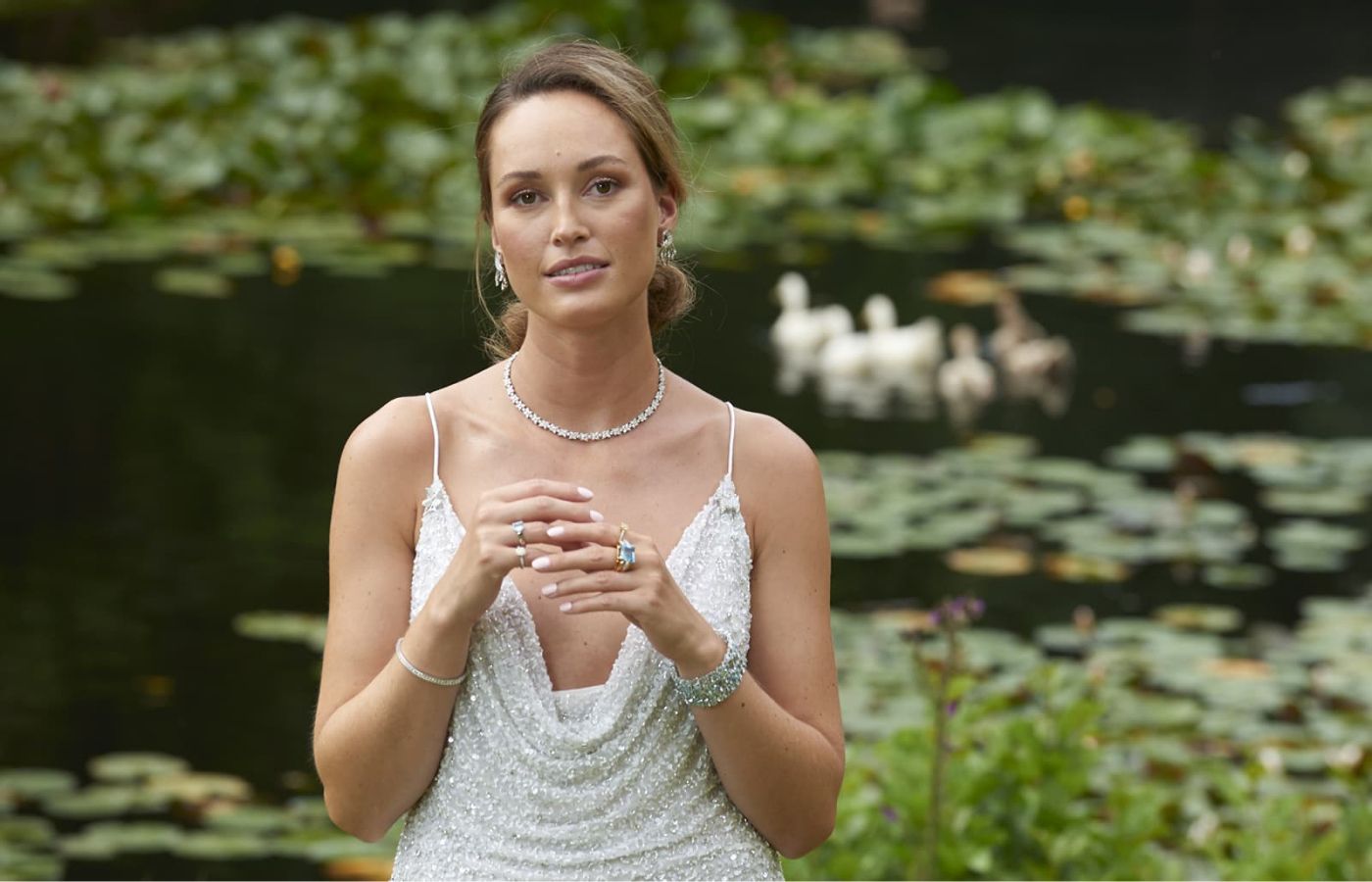 Model wearing aquamarine and diamond jewels by Susannah Lovis