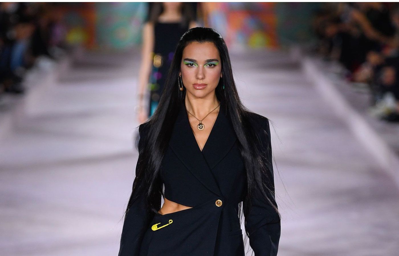  Singer Dua Lipa appears at the Versace Spring Summer 2022 runway show