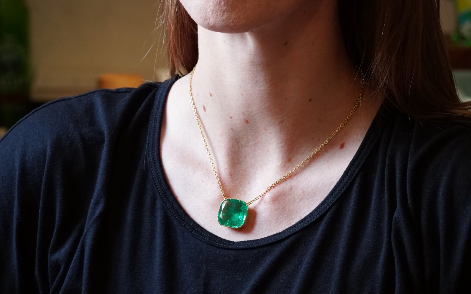 Jogani necklace with a 22.36 carat cushion-cut Colombian emerald in 20k gold