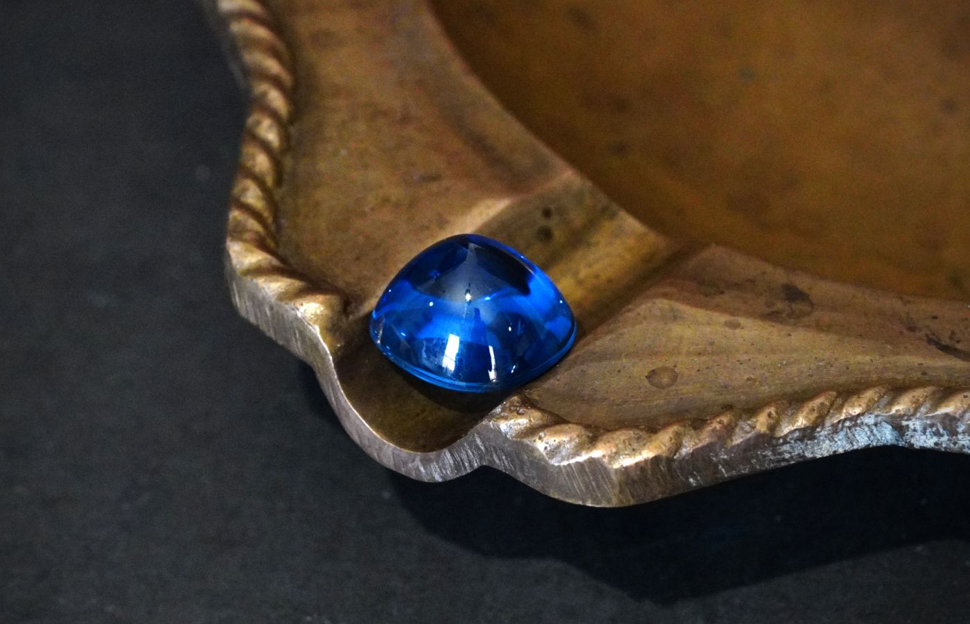  A 10.99 carat unheated Burmese sapphire sugarloaf cabochon, available at the Jogani Gallery