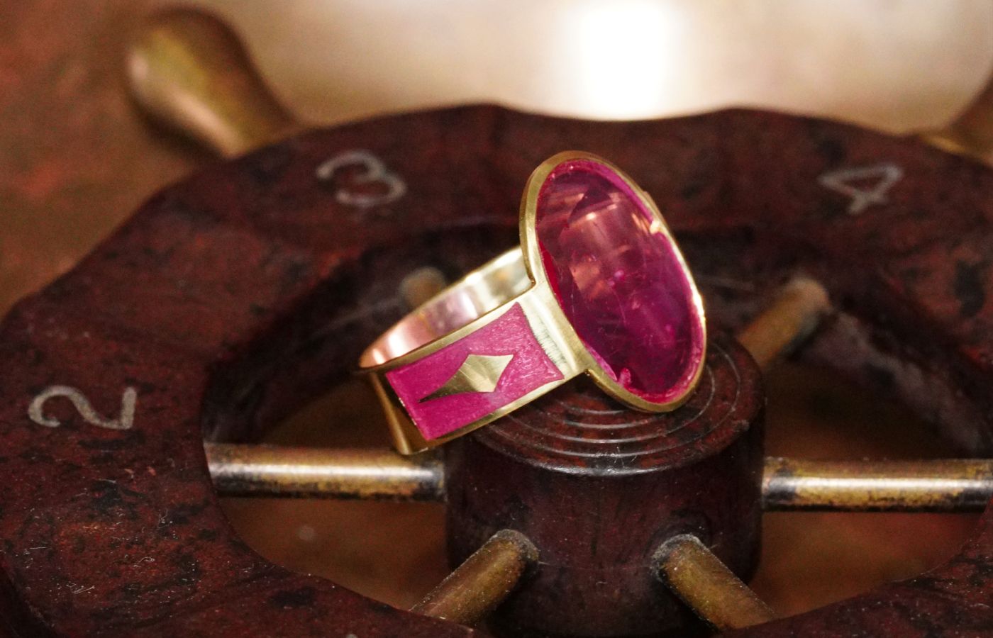  Jogani handmade cigar band ring with a 2.14 carat oval-shaped portrait-cut pink Burmese sapphire and enameled shank in 18k gold